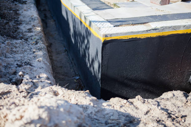 Professional Waterproofing technician working in Smithfield, NC